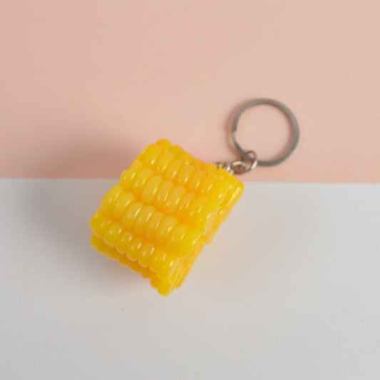 Ensemble de petits jouets en PVC représentant des légumes miniatures, comprenant : 3 porte-clés hot-dog, 3 porte-clés maïs, 3 porte-clés brocoli, 10 porte-clés champignons, 5 porte-clés racine de lotus, 5 porte-clés varech, 5 porte-clés saucisse de jambon.